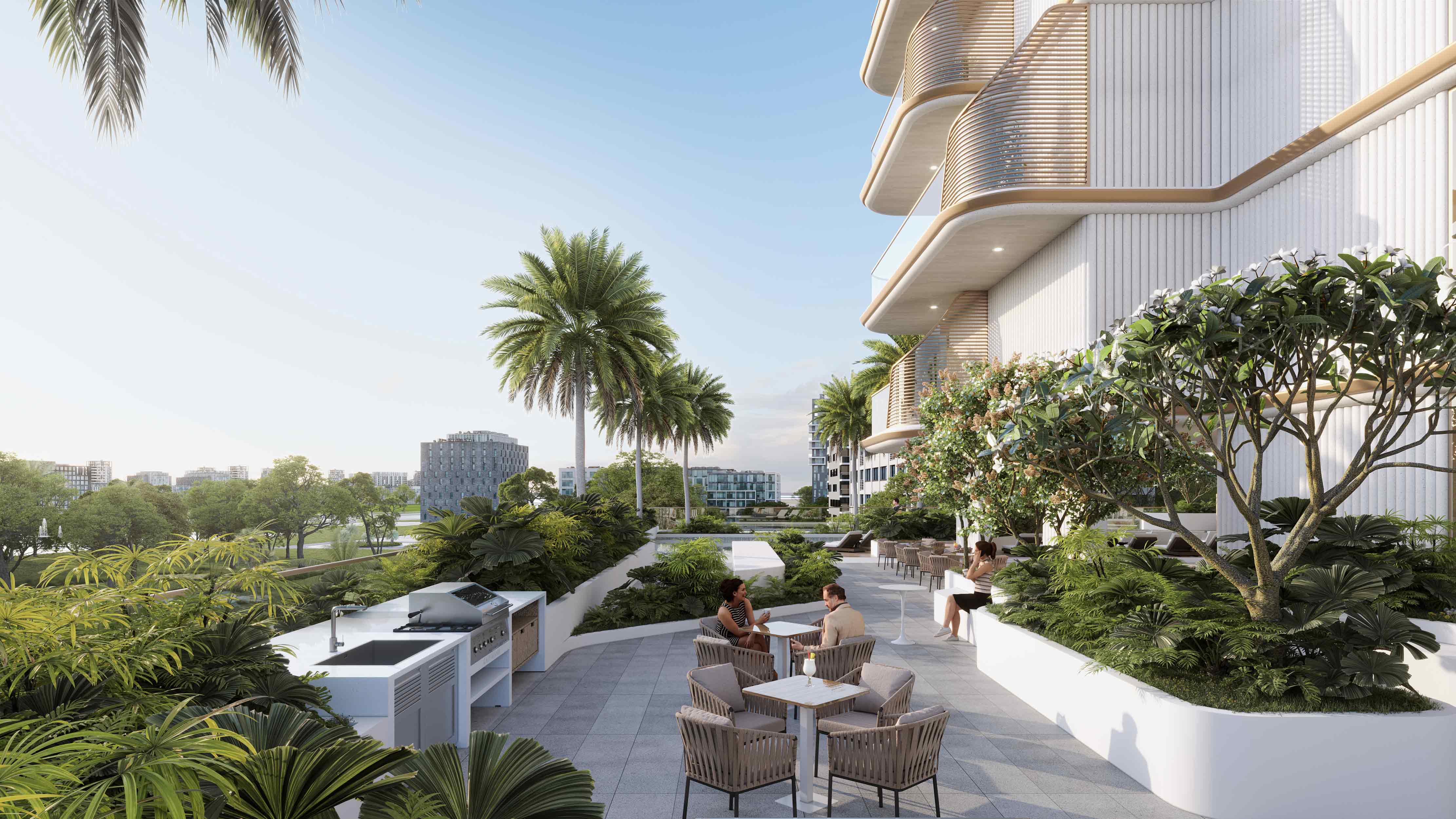 Sunset Bay Grand By Imtiaz Outdoor area with modern seating, lush greenery, and a grill station, overlooking contemporary buildings and trees.